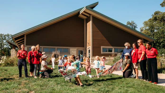 Creekside Forest School students and staff participated in a ribbon-cutting for the new school at the Indian Creek Nature Center Thursday, Sept. 16, 2021. LIZ ZABEL PHOTO/INDIAN CREEK NATURE CENTER