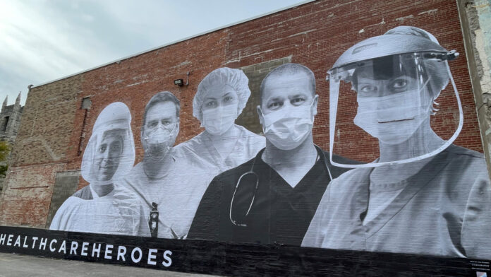 Mural honoring health care workers unveiled in downtown Cedar Rapids