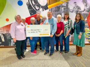 Theresa Dunkin, Barb Dickson, Mary Jane Sweeney, (Optimist Club), Eric Benson (Aureon), Rita Roberts, Dave Roberts, Mary K. Mitchell, and Laura Lacombe (Optimist Club), Bre Horstman (South Slope). CREDIT SOUTH SLOPE