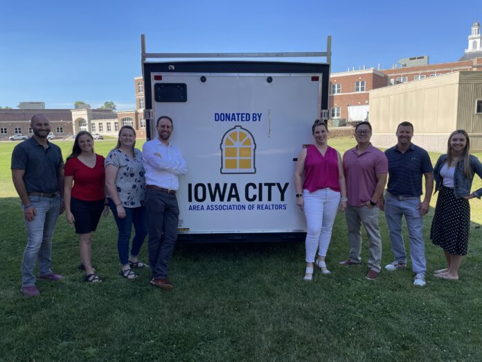 The Iowa City Association of Realtors donated a trailer for Iowa City High School's vocational trade program.