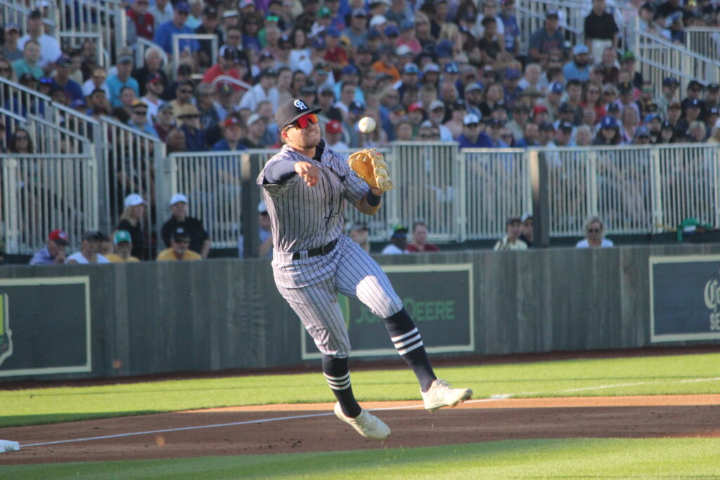Cedar Rapids third baseman Seth Gray makes a running throw during the first minor league game played at the "Field of Dreams" movie site. With a capacity crowd of 8,000 in attendance Tuesday, Gray's Kernels fell 7-2 to their regional rivals, the Quad Cities River Bandits. Two nights later, the Chicago Cubs defeated the Cincinnati Reds, 4-2, in the second annual Major League Baseball game saluting the famed film. The games and events surrounding them have sparked development plans in Dyersville, Iowa, with Iowa awarding a $12.5 million grant this week to support the tourism attraction's expansion.