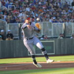 Cedar Rapids third baseman Seth Gray makes a running throw during the first minor league game played at the "Field of Dreams" movie site. With a capacity crowd of 8,000 in attendance Tuesday, Gray's Kernels fell 7-2 to their regional rivals, the Quad Cities River Bandits. Two nights later, the Chicago Cubs defeated the Cincinnati Reds, 4-2, in the second annual Major League Baseball game saluting the famed film. The games and events surrounding them have sparked development plans in Dyersville, Iowa, with Iowa awarding a $12.5 million grant this week to support the tourism attraction's expansion.