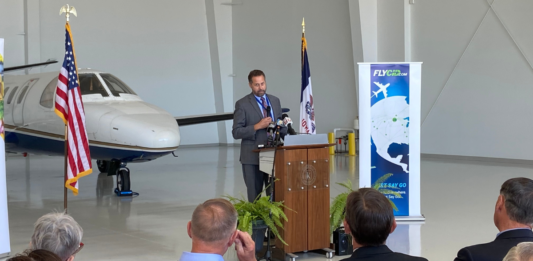 Eastern Iowa Airport Director Marty Lenss speaks to the audience during a federal grant funding announcement for a new Kirkwood aviation program Sept. 28.