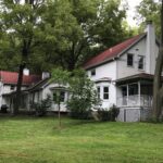 A 1890's farmhouse with a 1992 addition completed using the 1890's architectural theme. on Two Horse Farm in Solon.