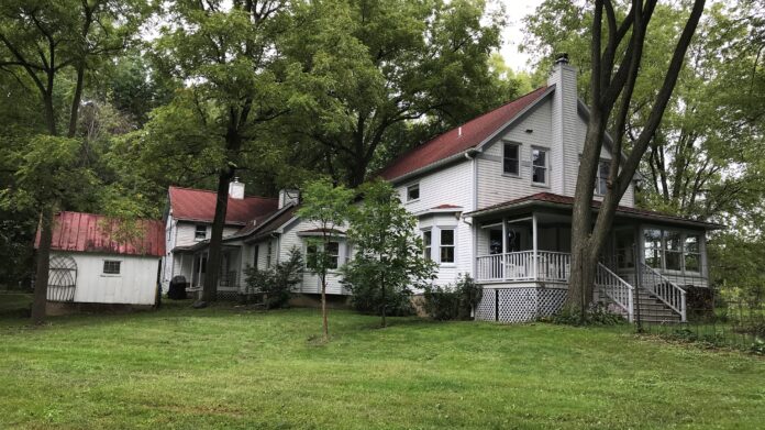 A 1890's farmhouse with a 1992 addition completed using the 1890's architectural theme. on Two Horse Farm in Solon.