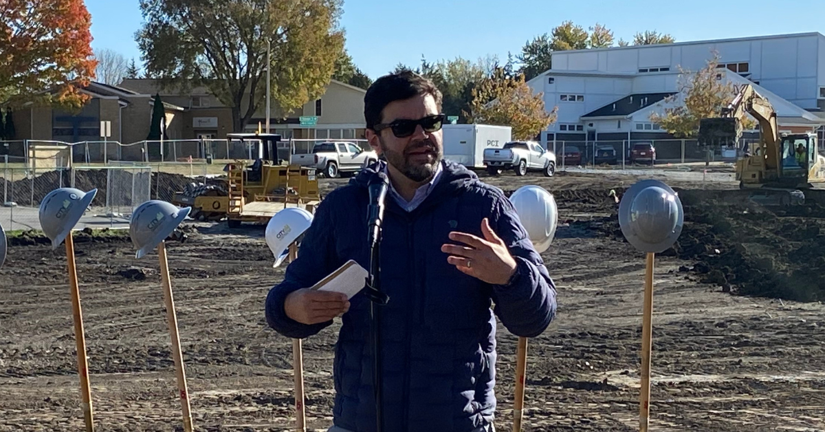 North LIberty Communications Director Nick Bergus addresses the crowd during an Oct. 19 groundbreaking of the new city hall. It is expected to be complete by April 2024.