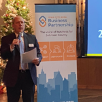 Cedar Rapids Metro Economic Alliance Executive Director Doug Neumann outlines top 2023 issues to an audience of statewide leaders Dec. 8 at Cedar Ridge Winery & Distillery.