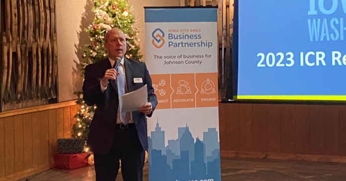 Cedar Rapids Metro Economic Alliance Executive Director Doug Neumann outlines top 2023 issues to an audience of statewide leaders Dec. 8 at Cedar Ridge Winery & Distillery.