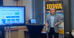 Ibrahim Demir, chief architect of the IFC-developed Iowa Flood Information System, demonstrates the capability of hydroinformatics visualizations. CREDIT NOAH TONG