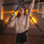 Caitlin Clark holds a bag of Almost Famous Popcorn during an advertisement supporting modernizing the Small Business Administration. CREDIT GOLDMAN SACHS YOUTUBE