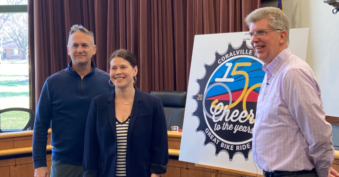 Local officials presented Coralville's logo and theme for its overnight RAGBRAI stop in July. CREDIT NOAH TONG