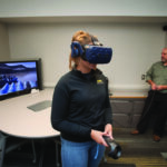 Jim Chaffee and Tippie student Isabel Anderson work with some of the college’s virtual reality technology.