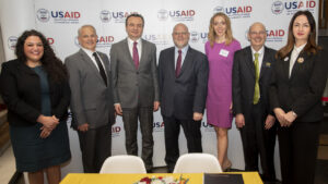 University of Iowa College of Education Dean Daniel L. Clay (second from left), Cassie Barnhardt, Higher Education and Student Affairs Associate Professor from the University of Iowa College of Education, (third from right), and Russell Ganim, associate provost and dean of UI International Programs (second from right), with the prime minister of Kosovo, Albany Kurti (third from the left), U.S ambassador in Kosovo, Jeffrey M. Hovenier (middle), Minister of Education, Science and Technology, Arberie Nagavci (far right), and USAID Kosovo's Mission Director, Zeinah Salahi (far left). CREDIT USAID