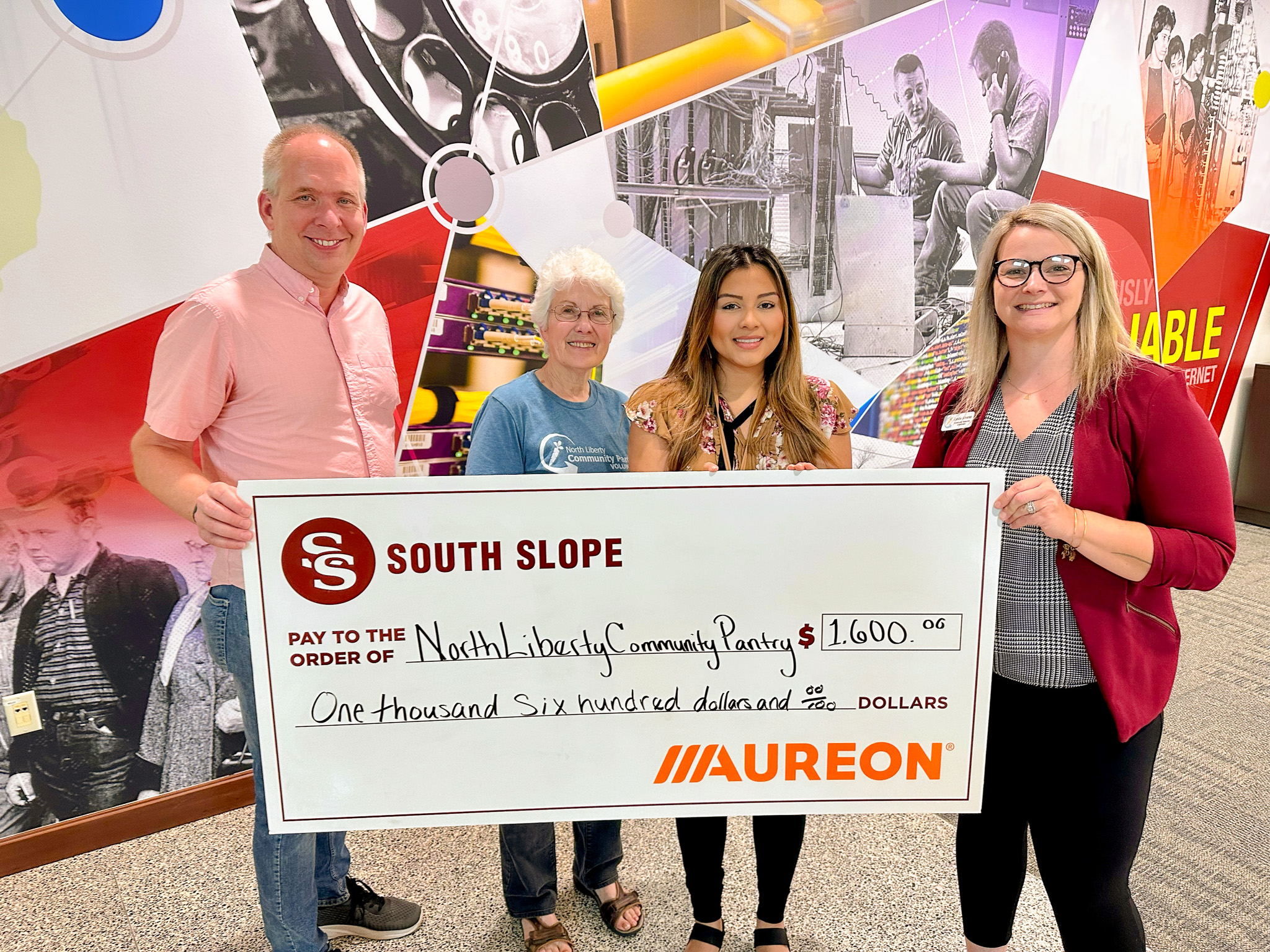The North Liberty Community Pantry is presented with a $1,600 grant from South Slope Communications and Auroeon.