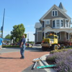 Goodwin House Moving of Washington, Iowa, navigates a roundabout in North Liberty as the Queen Anne Victorian home starts its trek on Tuesday, June 13. CREDIT CINDY HADISH