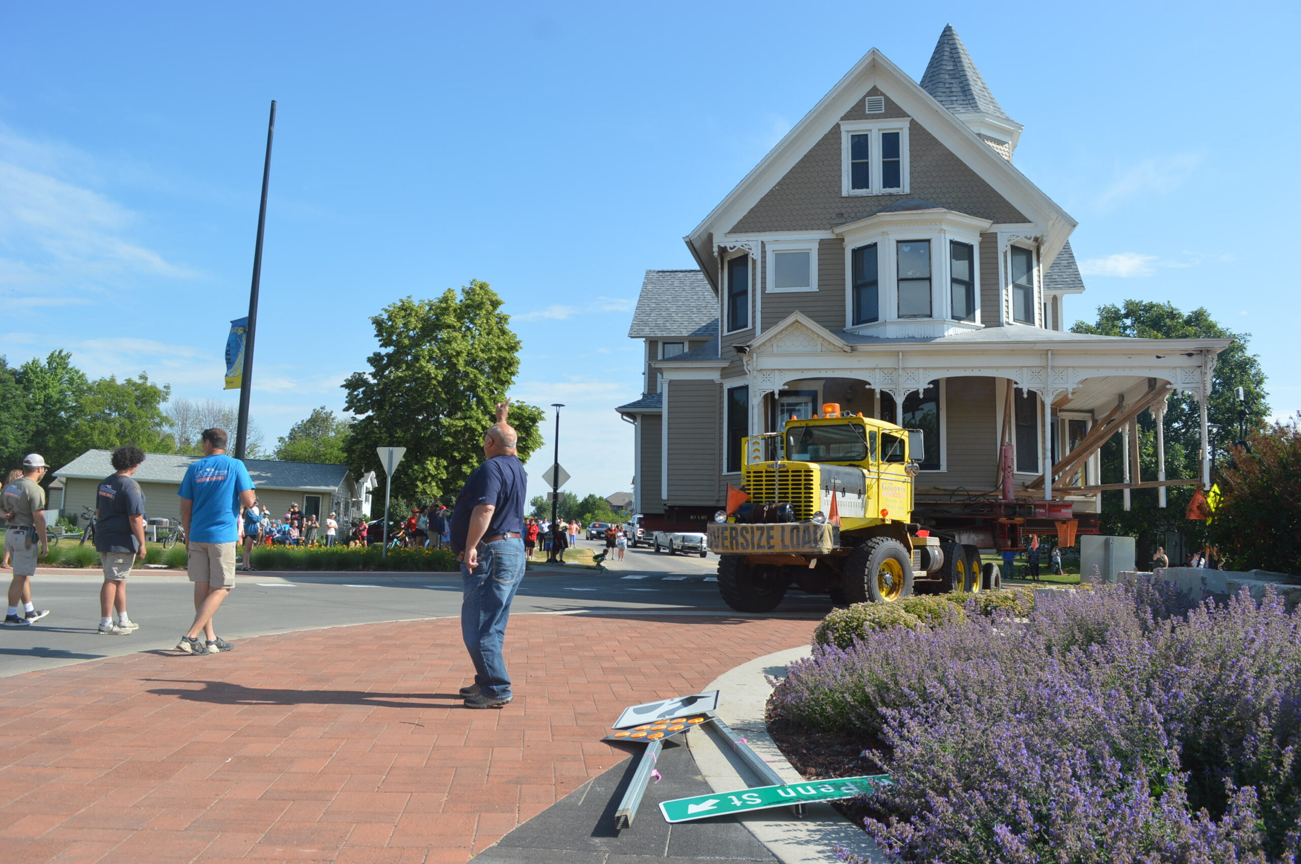 Goodwin House Moving of Washington, Iowa, navigates a roundabout in North Liberty as the Queen Anne Victorian home starts its trek on Tuesday, June 13. CREDIT CINDY HADISH