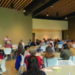 IWN Board Member Horacio Borgen presented to 60 attendees at the IWN’s celebratory kickoff event on June 11. He was a political exile from Nicaragua and immigrated to Iowa two years ago. CREDIT ELEANOR HILDEBRANDT.