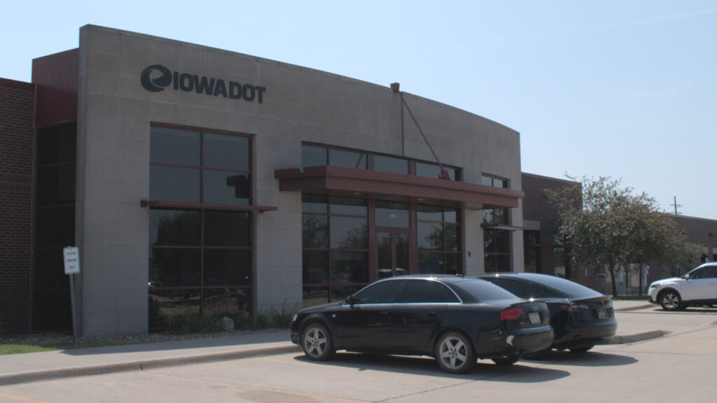 Cars are parked in front of the new DMV location in Coralville.