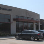 Cars are parked in front of the new DMV location in Coralville.