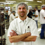 Former Bochner Chocolates president, Eric Bochner, stands in the company’s now closed Iowa City manufacturing center in 2008. CREDIT CBJ