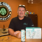 Mark Pattison, founder, COO, and board president of Solon-based Buck Creek Distributing water