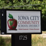 Iowa City Community School District sign by Dodge Street.