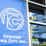 The Greater Iowa City, Inc. blue banner displays its new logo.