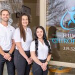 Humpal Chiropractic staff stand in front of the clinic.