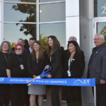 IDT president Demaris Mills is poised to cut the ribbon at IDT's new facility, 2400 Oakdale Blvd., Coralville, Oct. 17.