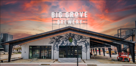 A view of the front entrance of the Big Grove Brewery’s Cedar Rapids taphouse at a recent sunset. CREDIT BIG GROVE