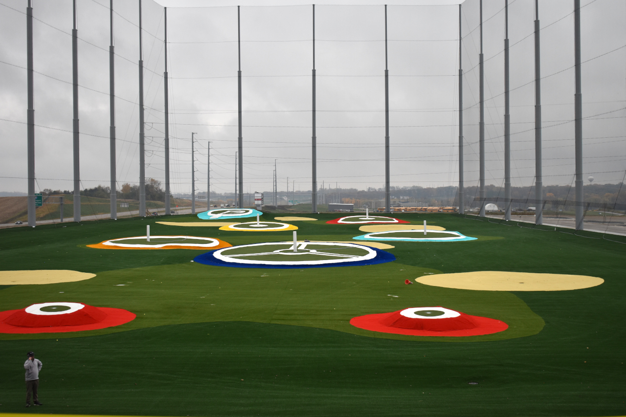 The outdoor driving range at Pinseekers uses Toptracer technology and features 10 Smart Target Greens that illuminate upon impact.