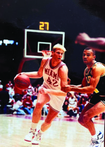 Former Miami University basketball player and MidWestOne CEO Chip Reeves dribbles on the court.