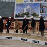 University of Iowa president Barbara J. Wilson, members of the Board of Regents and guest speakers pose during the groundbreaking ceremony of the new Health Sciences Academic Building.