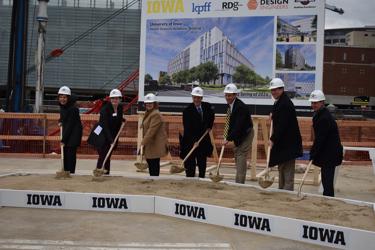 University of Iowa president Barbara J. Wilson, members of the Board of Regents and guest speakers pose during the groundbreaking ceremony of the new Health Sciences Academic Building.