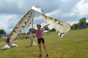 The color guard of Les Stentors Drum & Bugle Corps rehearses in August at South Tama County Middle School in Toledo. The corps traveled from Sherbrooke, Quebec, Canada, to compete at Tournament of Drums in Cedar Rapids. CREDIT CINDY HADISH