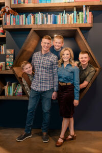 Katy Herbold of Sidekick Coffee & Books, poses with her family.