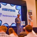 Kalvin Grabau Keele, managing partner of Northwestern Mutual Eastern Iowa speaks at 2023's Coolest Places to Work awards dinner, Nov. 30, 2023.