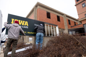 Signage is updated at University of Iowa Health Care Medical Center Downtown on Wednesday, Jan. 31, 2024, on the day that ownership of Mercy Iowa City officially transitioned to UI Health Care.