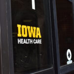New door decals unveiled as UIHC takes on Mercy Iowa City operations.