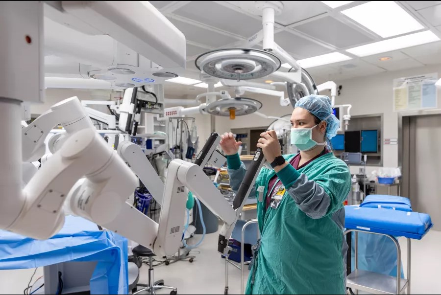 Megan Mulholland, RN, BSN, prepares an Operating Room and robot for a Robotic Prostatectomy at University of Iowa Hospitals and Clinics.