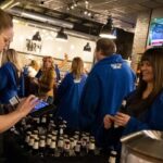 Snuggie Crawl participants visit a local establishment. The Snuggie Crawl is part of North Liberty's Beat the Bitter winter festival.
