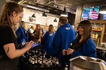 Snuggie Crawl participants visit a local establishment. The Snuggie Crawl is part of North Liberty's Beat the Bitter winter festival.