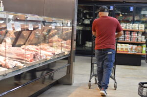 A Vytyl employee walks past the Halal meats section, one of the major draws at the Cedar Rapids store. CREDIT CINDY HADISH