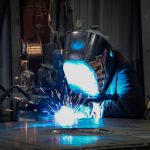 Welder Pamela Lewis works with KT Pacer's sub-assembly/small parts weldment team.