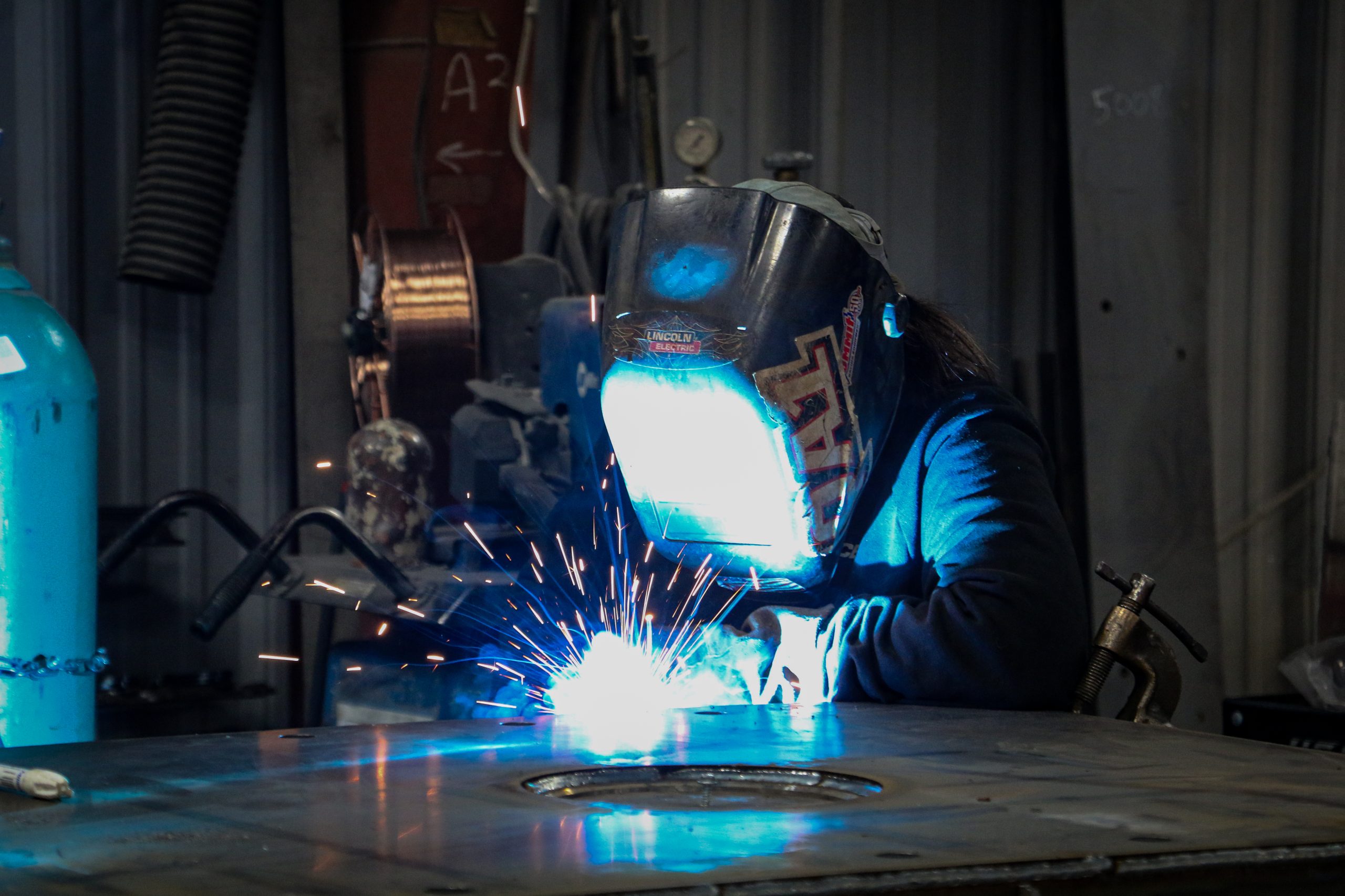 Welder Pamela Lewis works with KT Pacer's sub-assembly/small parts weldment team.