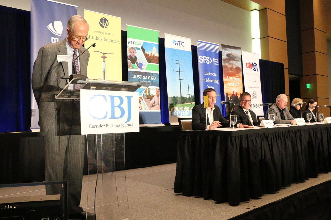 Jack Evans, Chair of the Board of the Hall-Perrine Foundation, moderates a panel of Corridor business leaders at the CBJ's 2024 Economic Forecast Luncheon.