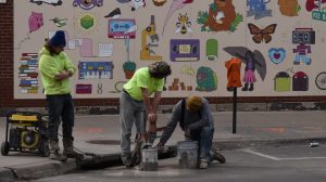 Construction workers begin preliminary work on Dubuque Street.