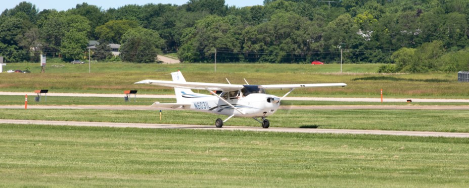 An airplane taxis down the runway at the Iowa City Municipal Airport. The airport received $442,800 to fund a solar project that will reduce electric utility costs in half.