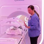 Radiation Therapist Jillian York operates the MR-linac, an MRI-guided radiation therapy system, for a simulated pediatric radiation oncology appointment