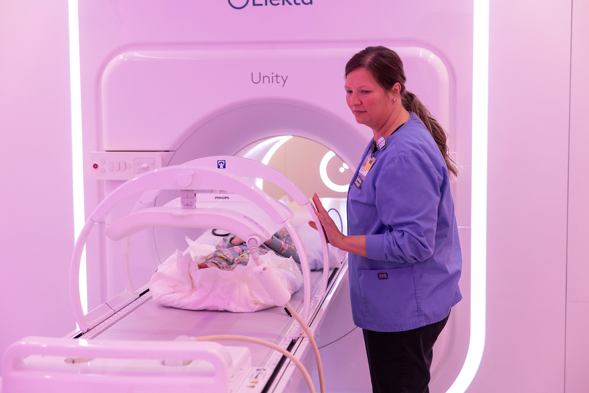 Radiation Therapist Jillian York operates the MR-linac, an MRI-guided radiation therapy system, for a simulated pediatric radiation oncology appointment